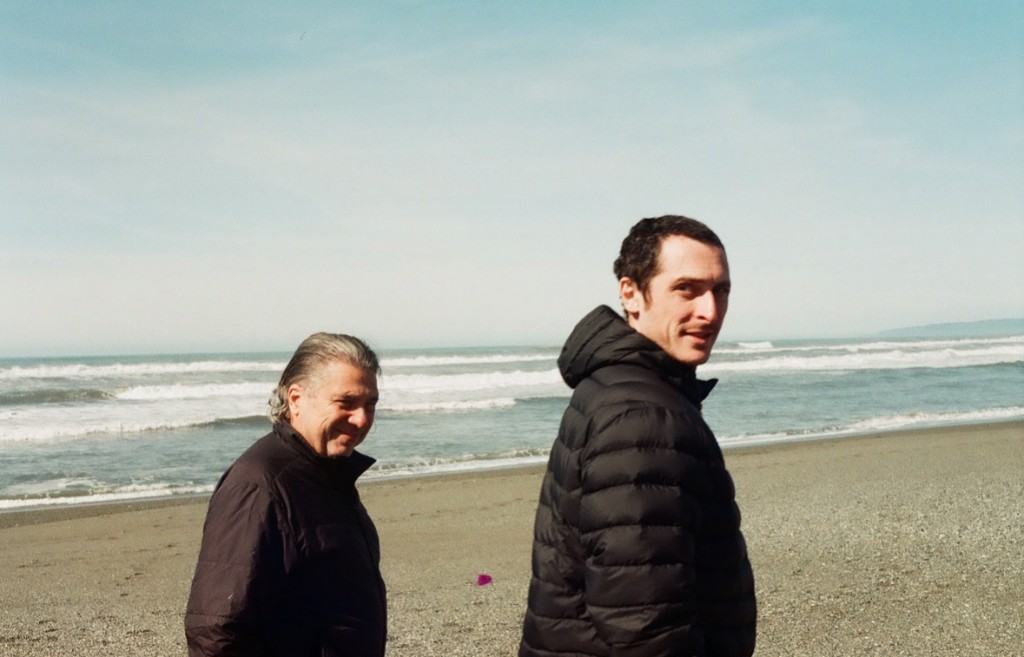FractiAI co-founders on the beach: Pru Mendez at left, Daniel Ari Friedman, Ph.D. at right.
